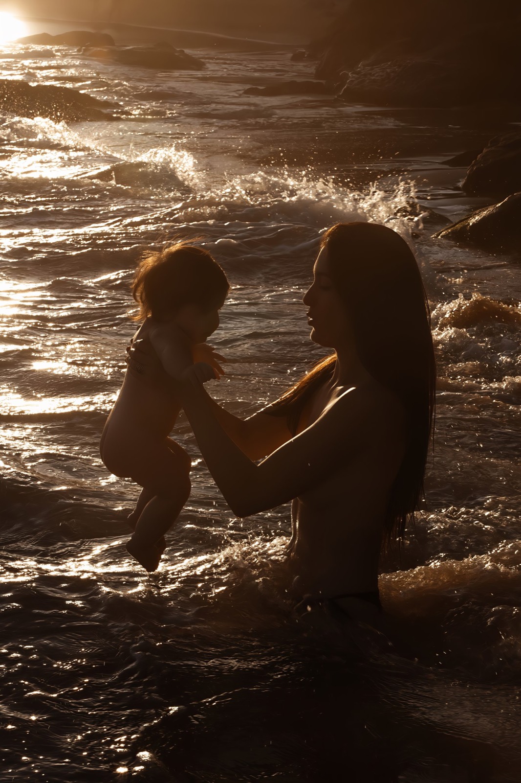 Mother and child sharing a quiet moment in the sea