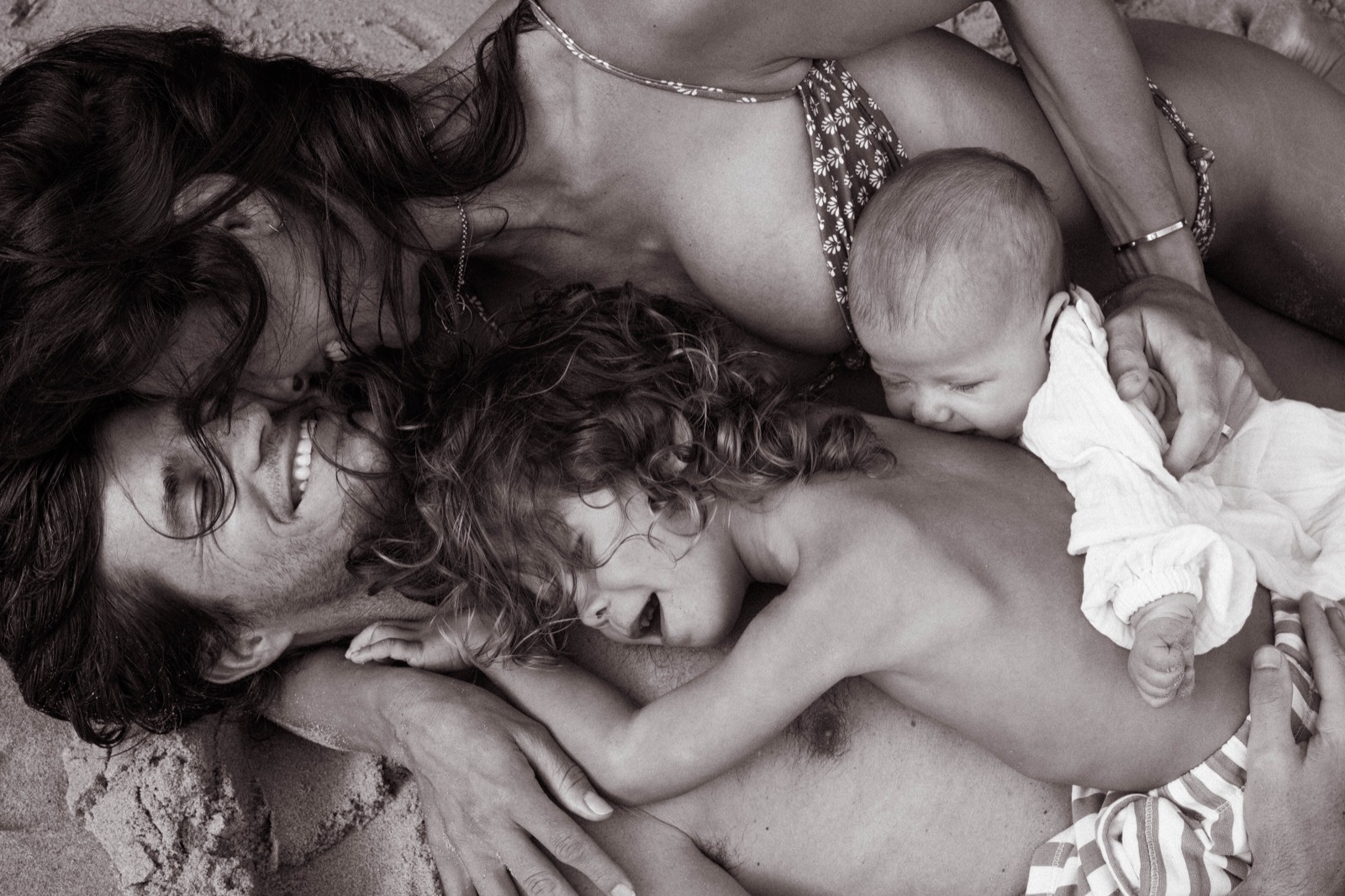 Parents and their children sharing a joyful embrace